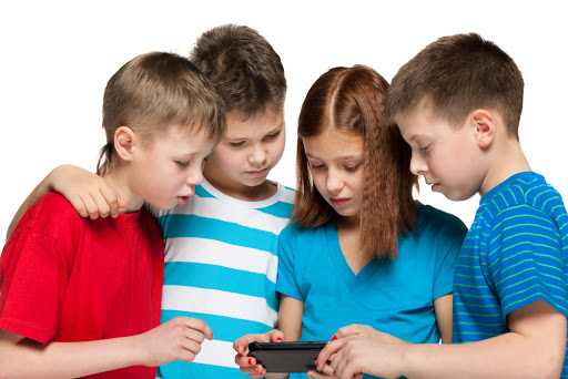 Group of four children are playing with smartphone – it