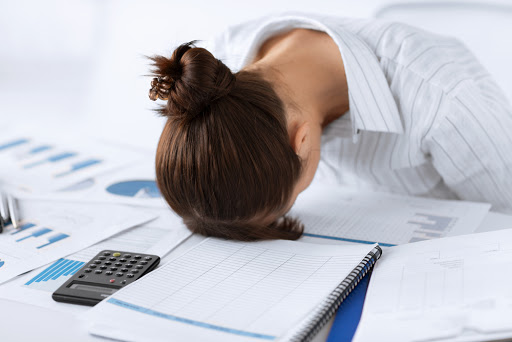 picture of woman sleeping at work in funny pose &#8211; it