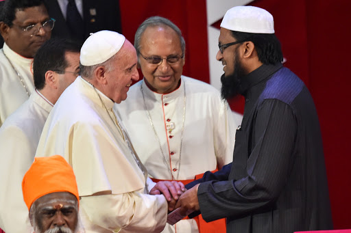 Pope Francis shakes hands with Muslim Maulavi Ash-Sheikh M.F.M. Fazil &#8211; AFP