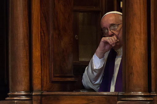 Pope Francis sitting in a confession booth &#8211; AFP