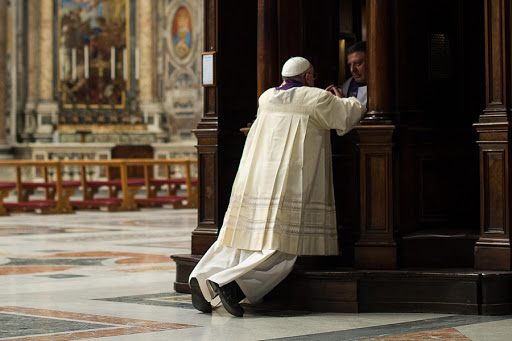 Pope Francis during a confession &#8211; crop &#8211; AFP