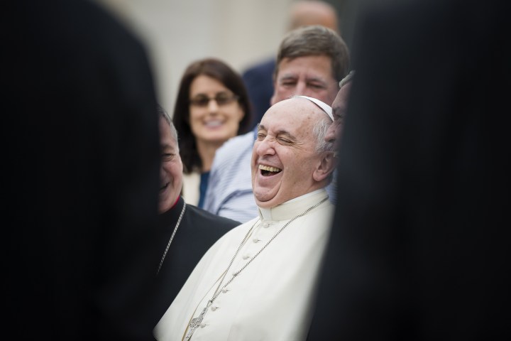 Pope Francis laughs
