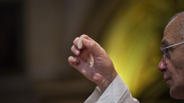 Holy Communion – Catholic priest