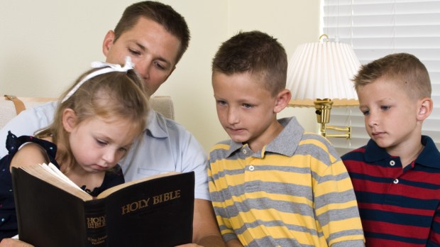 WEB FATHER KIDS HOLY BIBLE © JHDT PRODUCTIONS Shutterstock