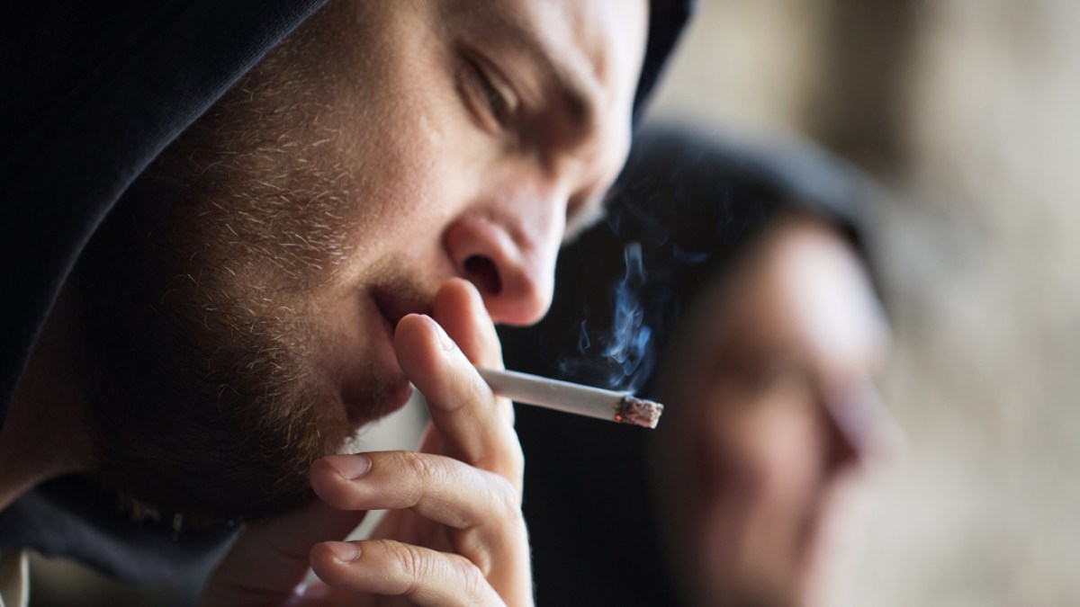 WEB3-ADDICTION-ABUSE-DRUGS-CIGARETTE-SMOKING-YOUNG-MAN-HOODIE-shutterstock_468888152-Shutterstock