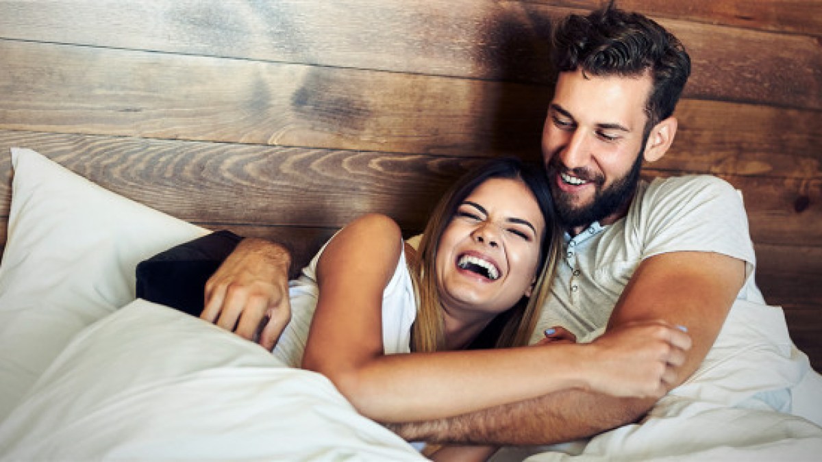 web3-laughing-laugh-husband-wife-bed-love-smiles-shutterstock