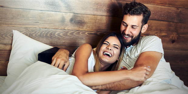 web3-laughing-laugh-husband-wife-bed-love-smiles-shutterstock