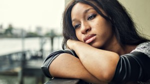 WEB3 SAD WOMAN ALONE PENSIVE AFRICAN AMERICAN Shutterstock