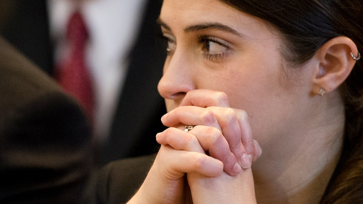 WEB3-YOUNG-WOMAN-PRAYING-MASS-CHURCH-Jeffrey-Bruno