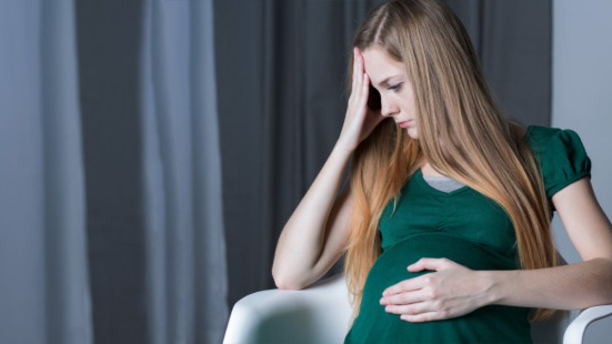 web3-mom-pregnant-belly-chair-concerned-sad-shutterstock
