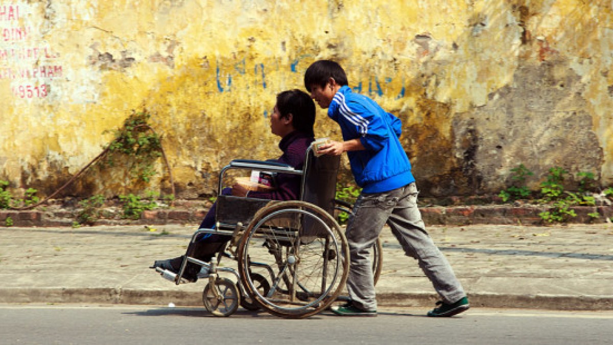 web3-helping-people-boys-pushing-push-wheelchair-disabled-shutterstock_168063155-john-bill-ai