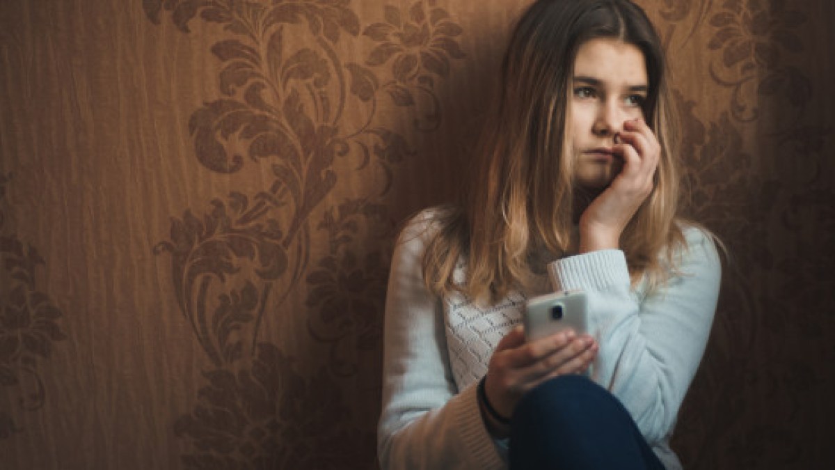 web3-sad-girl-alone-phone-teen-shutterstock