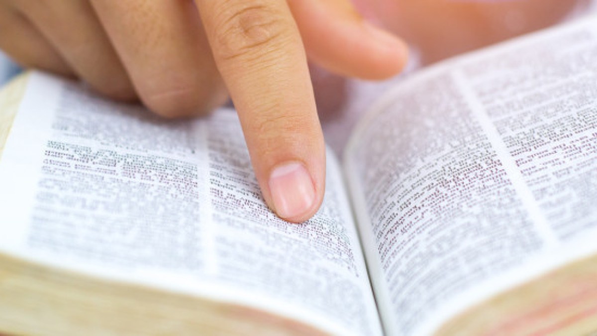 web3-man-hand-finger-bible-book-shutterstock