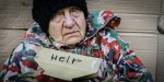 POOR WOMAN WITH HELP SIGN