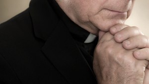 A priest praying