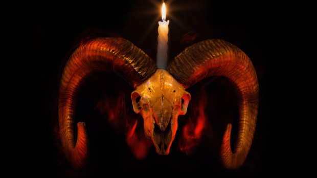 Skull of ram with lighted candle &#8211; Baphometh symbol from Taro cards