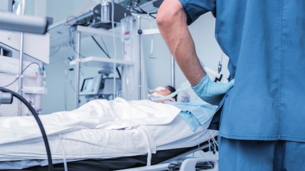 PATIENT IN HOSPITAL BED