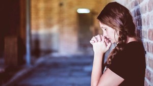WOMAN PRAYING