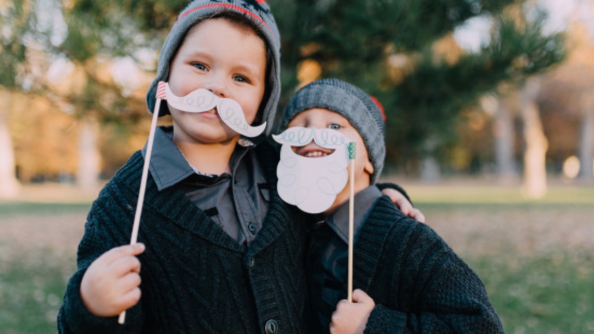 web3-santa-boys-children-child-photo-booth-prop-smile-christmas-stocksy-nited