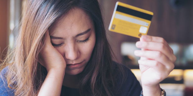 web3-woman-stress-money-debit-card-credit-card-shopping-money-management-shutterstock