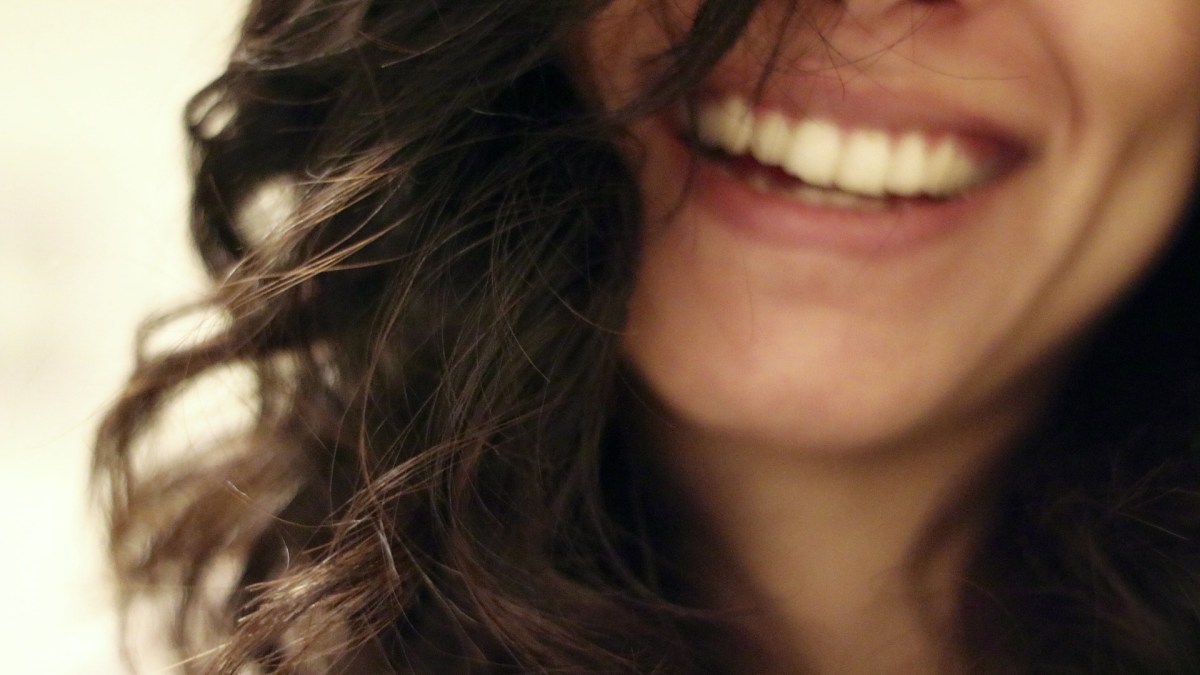 YOUNG WOMAN SMILING