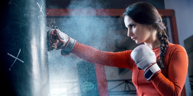 WOMAN,BOXING,PUNCHING BAG