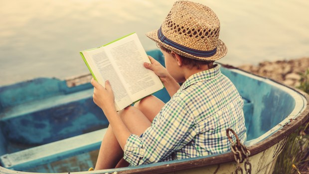 BOY READING BOOK