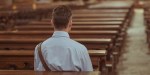 MAN SITTING IN PEW