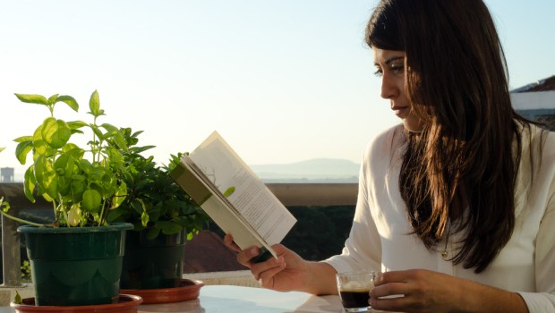 WOMAN,READING, TABLE