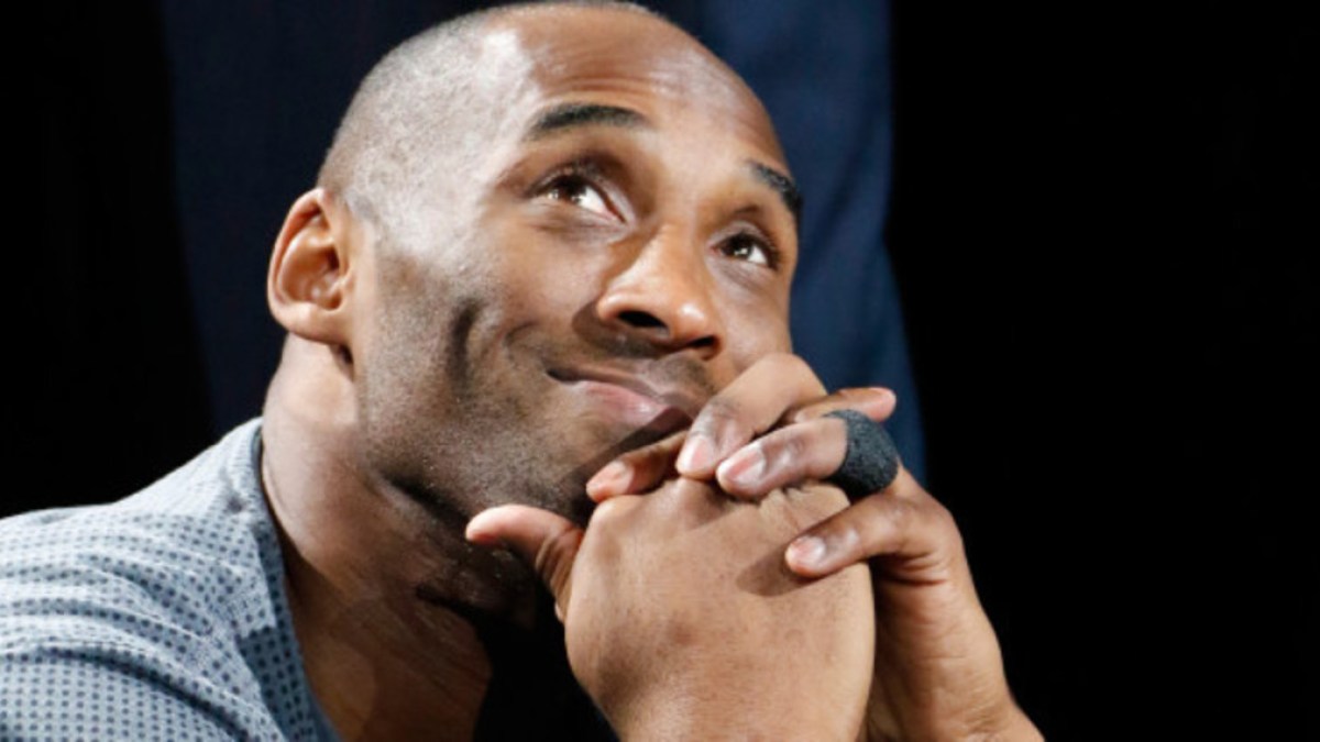 web-kobe-bryant-smiling-hands-clasped-ronald-cortes-getty-images