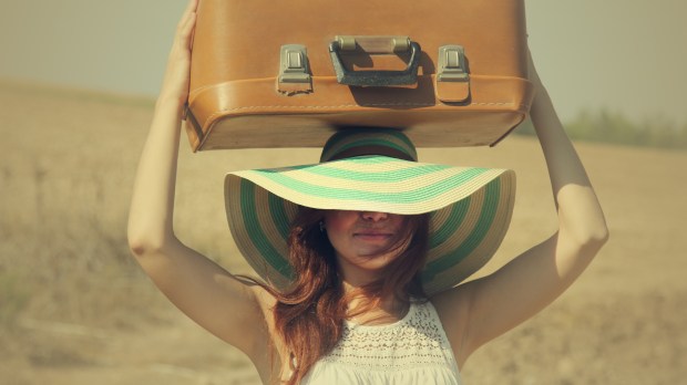 WOMAN WITH SUITCASE
