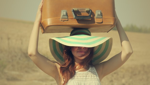 WOMAN WITH SUITCASE