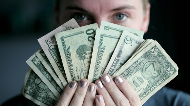 WOMAN HOLDING MONEY