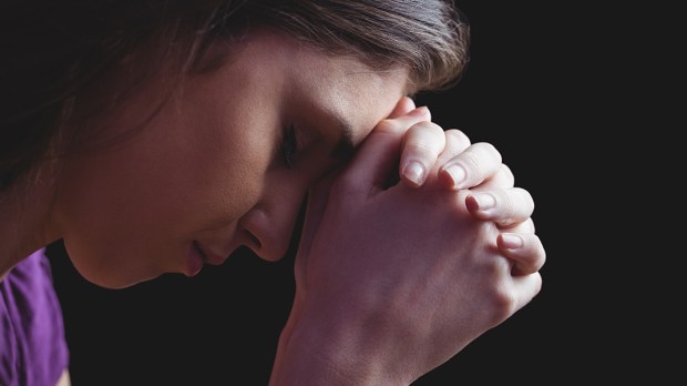 WOMAN PRAYING