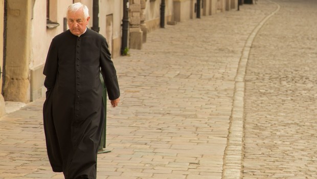 PRIEST WALKING
