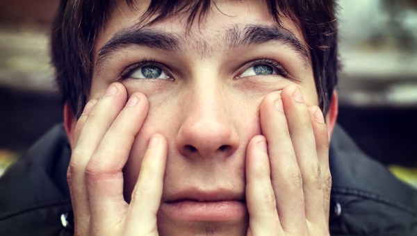 CLOSE UP OF YOUNG MAN