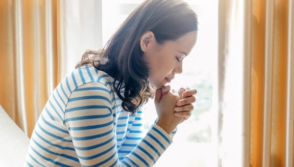 WOMAN PRAYING