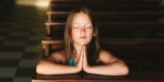 YOUNG GIRL,PRAYING,CHURCH PEW