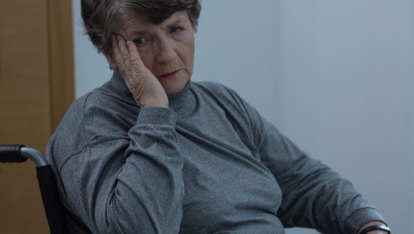 aged sad woman wheelchair