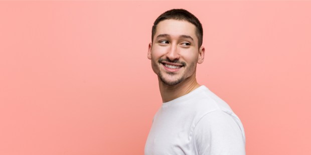 young casual man smiling