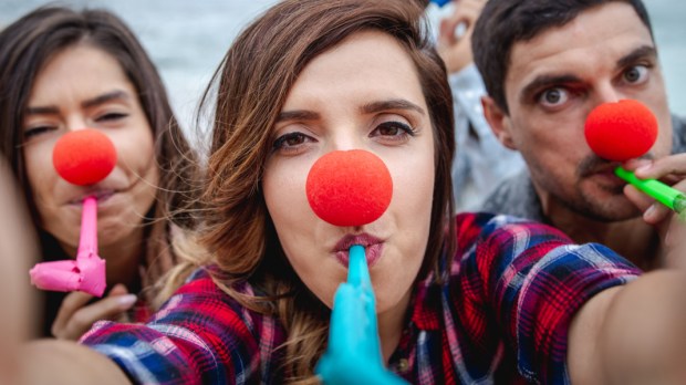 WEB3-Party-people-with-red-clown-noses-and-whistle-have-fun