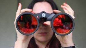 WOMAN, BINOCULARS, RED