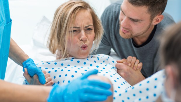 woman in labor with husband