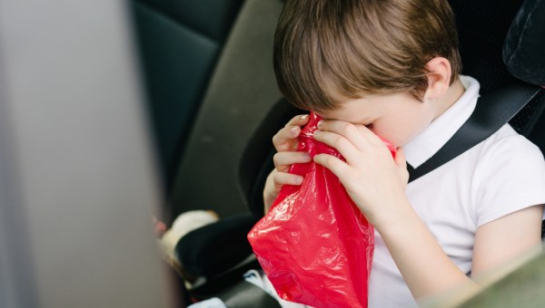 child vomiting in car