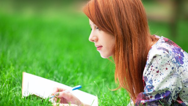 redhead girl writing