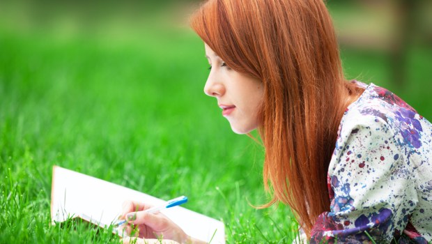 redhead girl writing