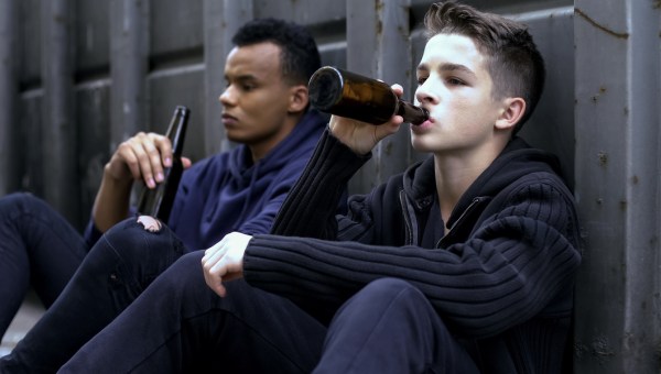 teenager guys drinking beer