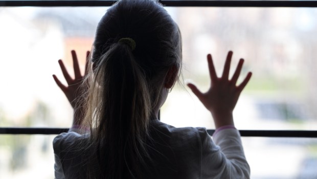 young girl at window