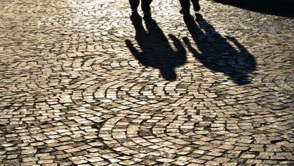 MEN, PAVEMENT, SHADOWS