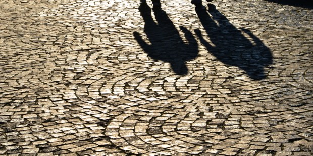 MEN, PAVEMENT, SHADOWS